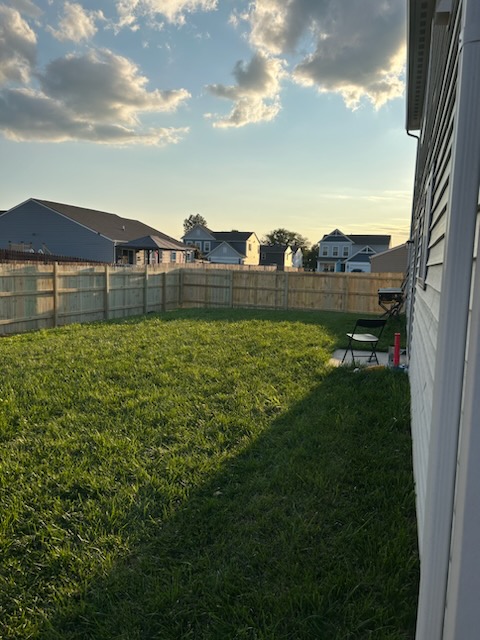 Newly built privacy fence, surrounding a small back yard.